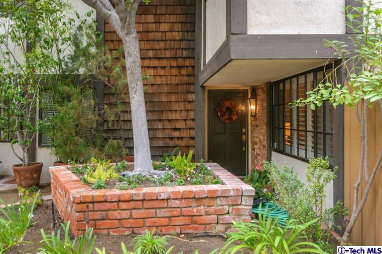 1445 Valley View Road, Unit 5 Glendale, CA 91202 - Photo 6 of 19 a front view of a house with a yard