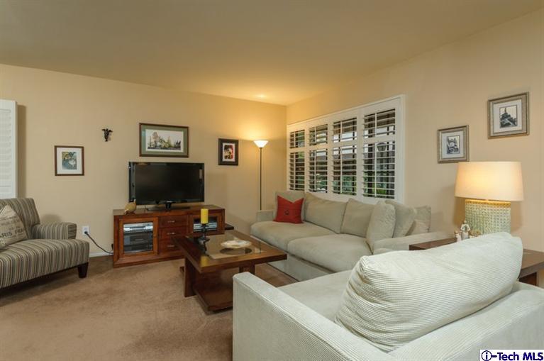 1445 Valley View Road, Unit 5 Glendale, CA 91202 - Photo 7 of 19 a living room with furniture and a flat screen tv