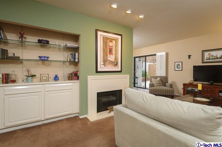 1445 Valley View Road, Unit 5 Glendale, CA 91202 - Photo 8 of 19 a living room with furniture a flat screen tv and a fireplace