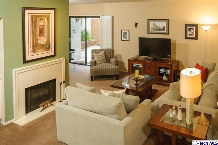1445 Valley View Road, Unit 5 Glendale, CA 91202 - Photo 10 of 19 a living room with furniture a fireplace and a flat screen tv