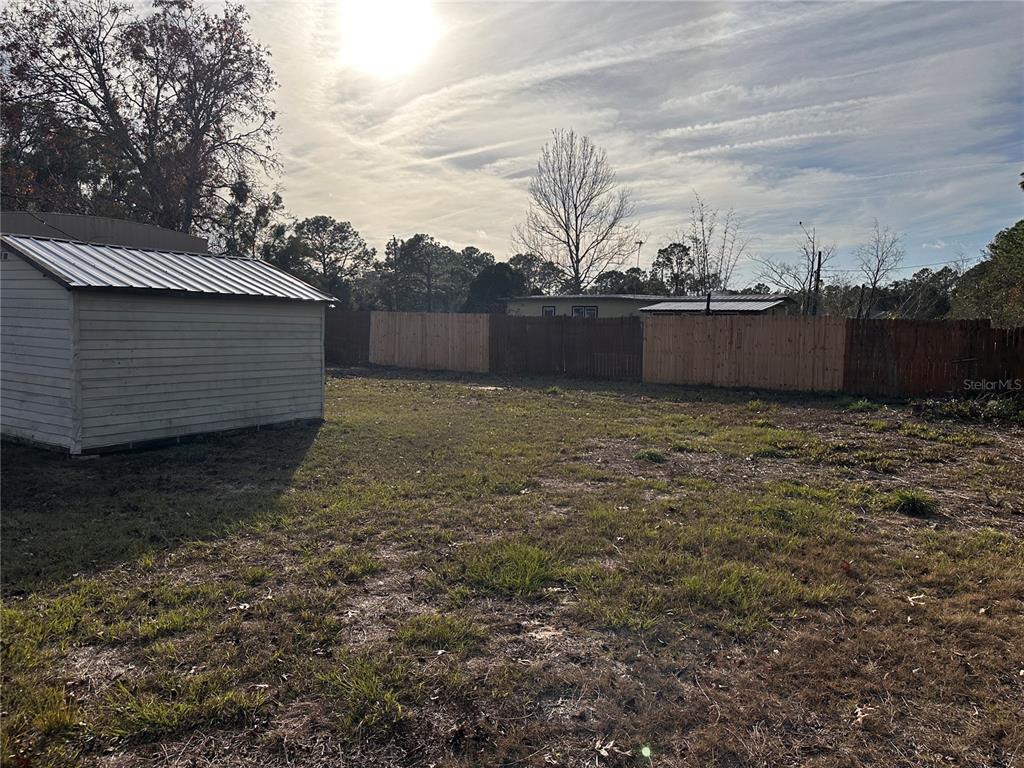 16083 Naples Street Brooksville, FL 34604 - Photo 4 of 16 a view of a backyard