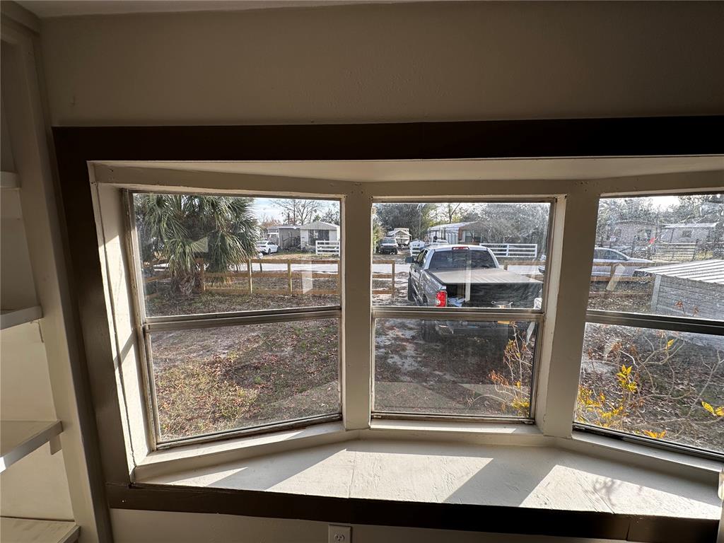 16083 Naples Street Brooksville, FL 34604 - Photo 7 of 16 a view of a living room and window