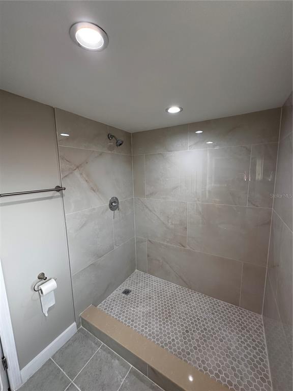 16083 Naples Street Brooksville, FL 34604 - Photo 8 of 16 a bathroom with a shower