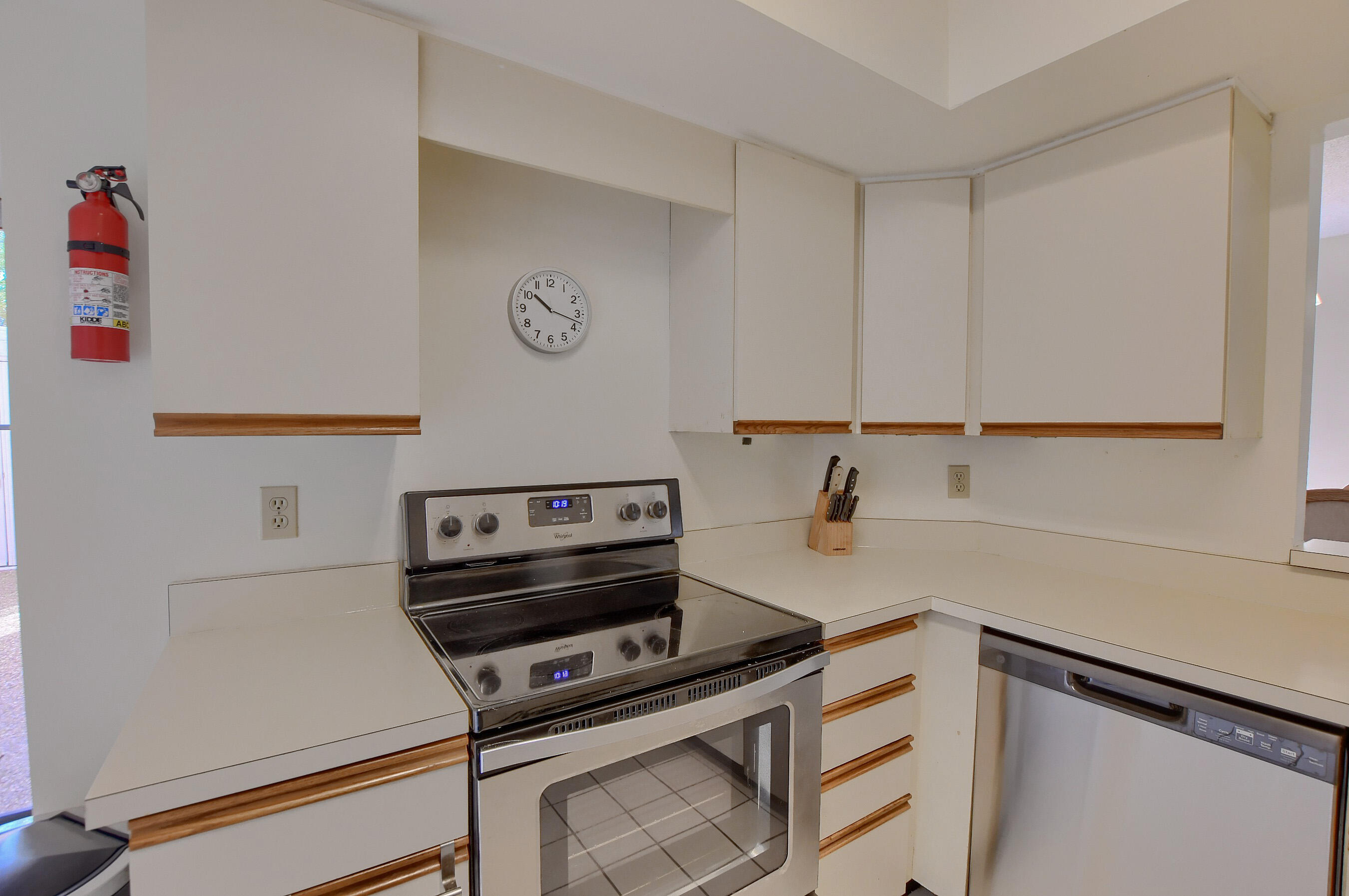 7896 Seville Place, Unit 1501 Boca Raton, FL 33433 - Photo 11 of 32 a kitchen with kitchen island a stove and a sink