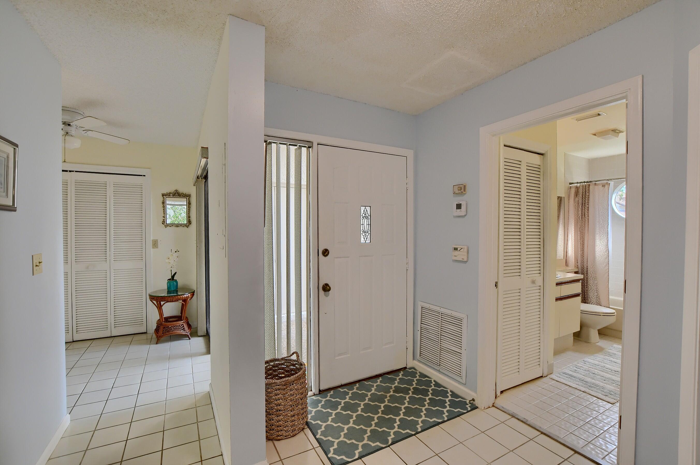7896 Seville Place, Unit 1501 Boca Raton, FL 33433 - Photo 3 of 32 a view of a bathroom with sink and mirror
