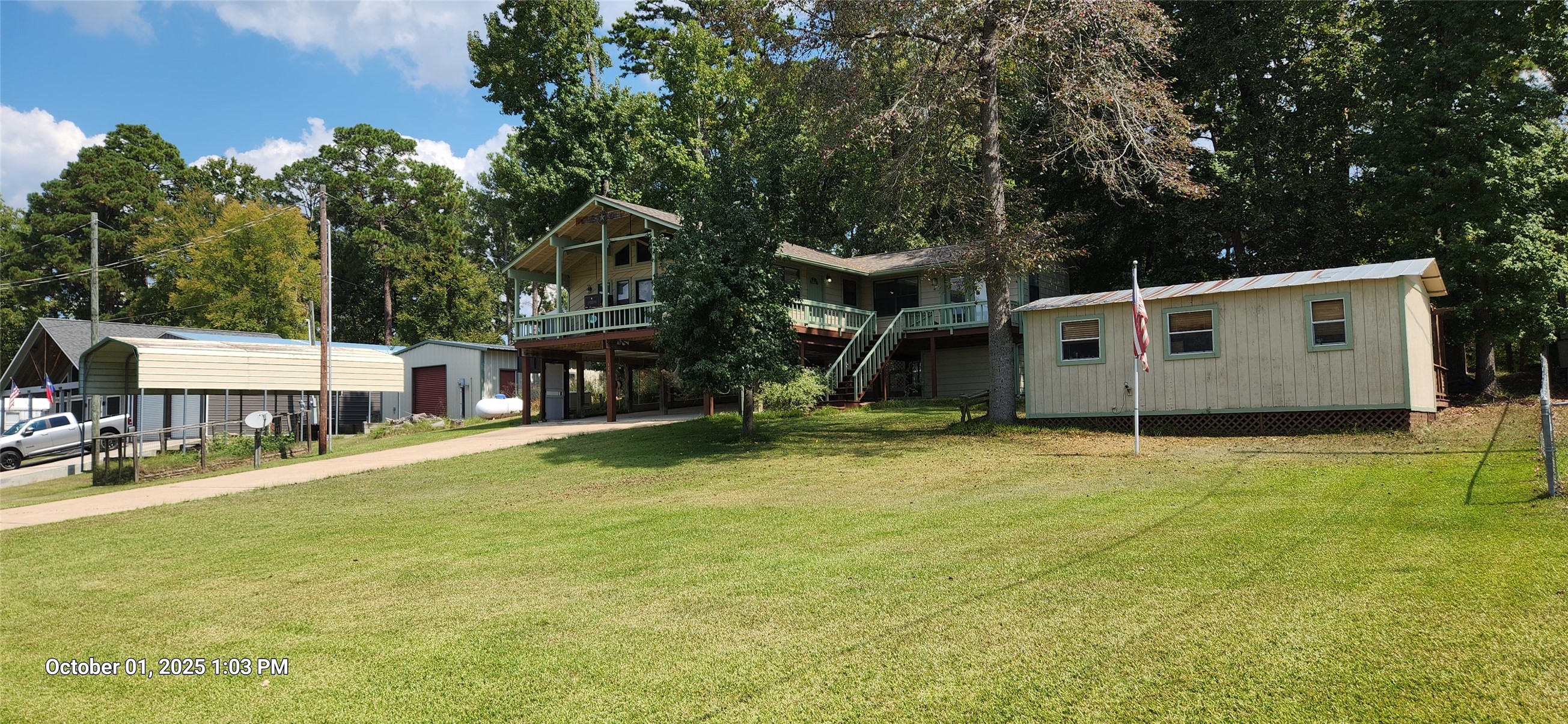 121 North Point Drive North Trinity, TX 75862 - Photo 17 of 37 a backyard of a house with table and chairs