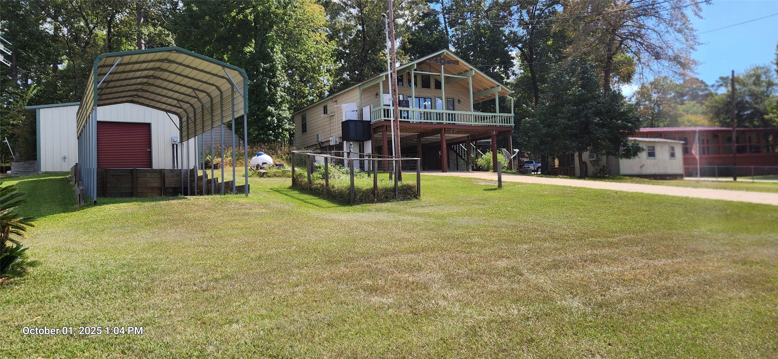 121 North Point Drive North Trinity, TX 75862 - Photo 3 of 37 a front view of house with a yard