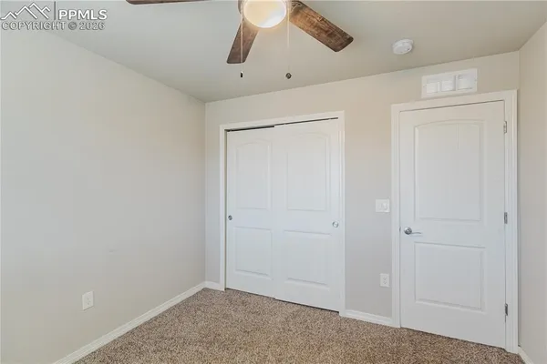 a bathroom with a sink a toilet and shower curtain