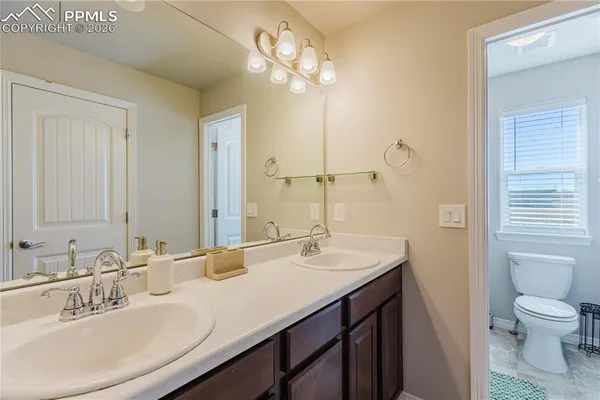 a bathroom with a shower and a toilet
