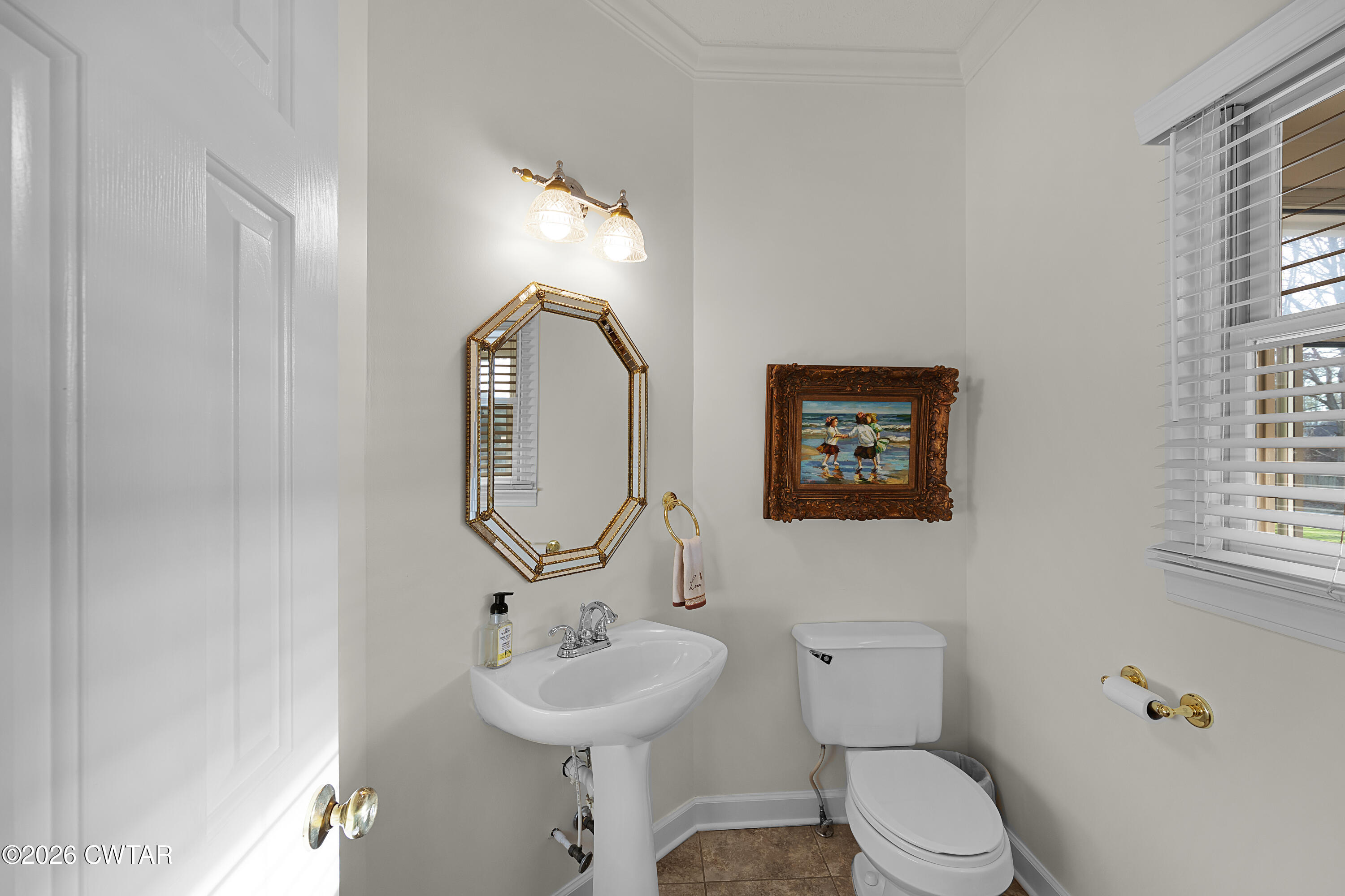 129 Pepper Tree Road Jackson, TN 38305 - Photo 16 of 35 a bathroom with a toilet sink and mirror
