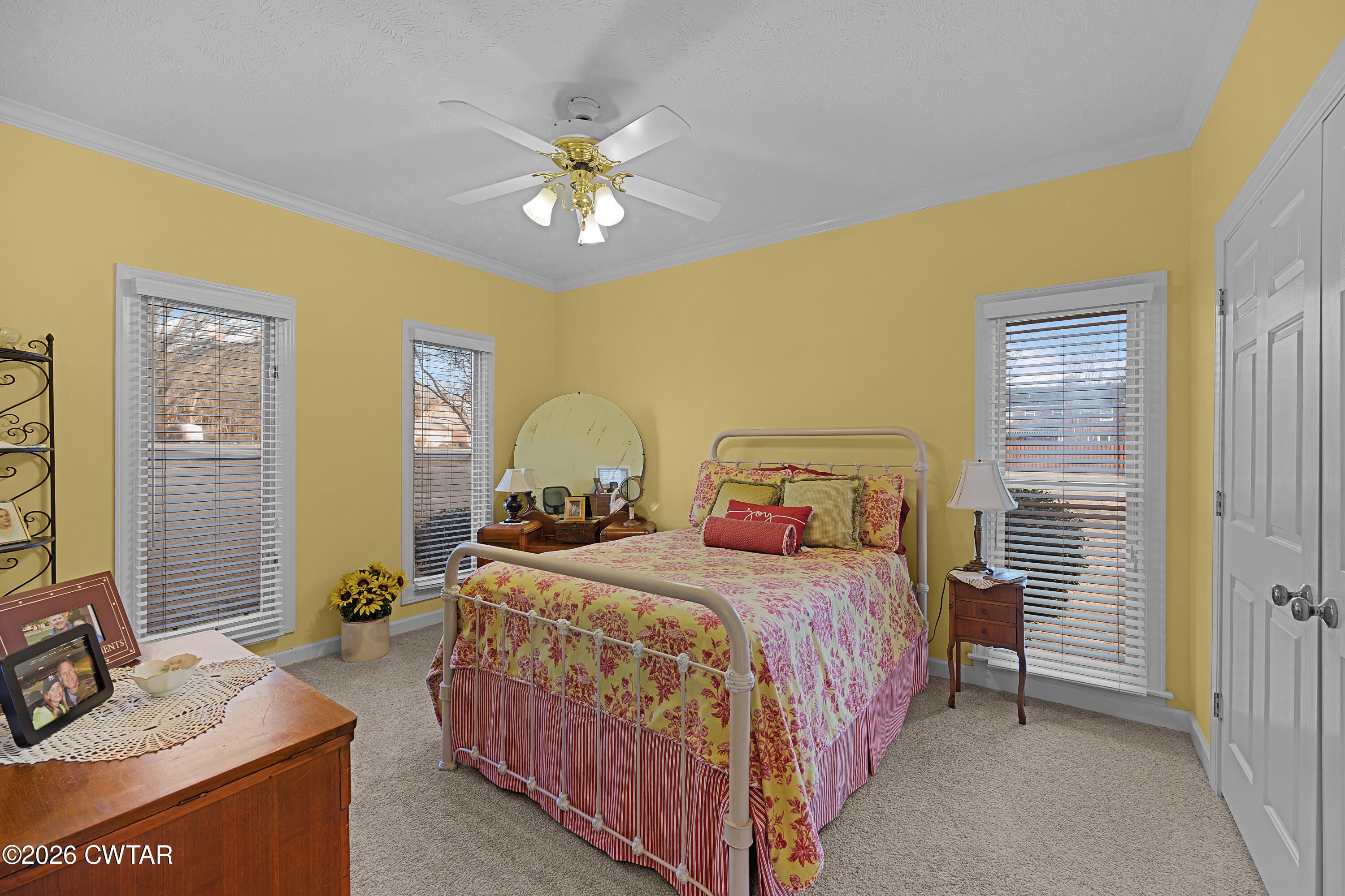 129 Pepper Tree Road Jackson, TN 38305 - Photo 20 of 35 a bedroom with a bed and a chandelier