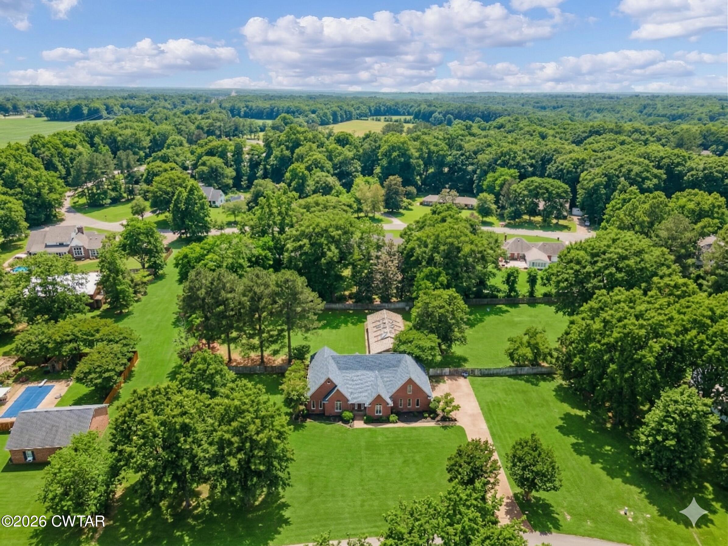 129 Pepper Tree Road Jackson, TN 38305 - Photo 2 of 35 an aerial view of a house with a yard
