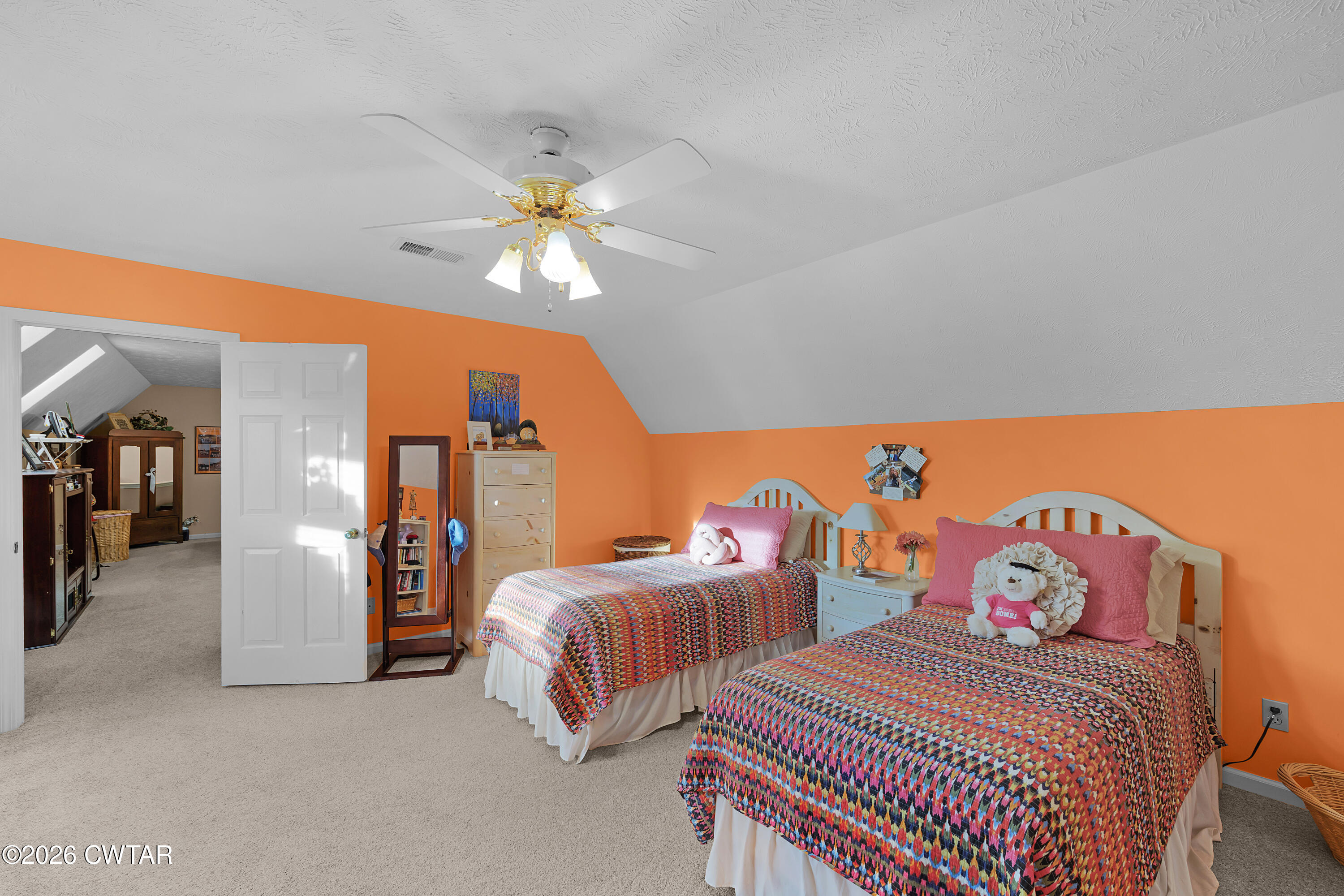 129 Pepper Tree Road Jackson, TN 38305 - Photo 23 of 35 a bedroom with two beds and a chandelier