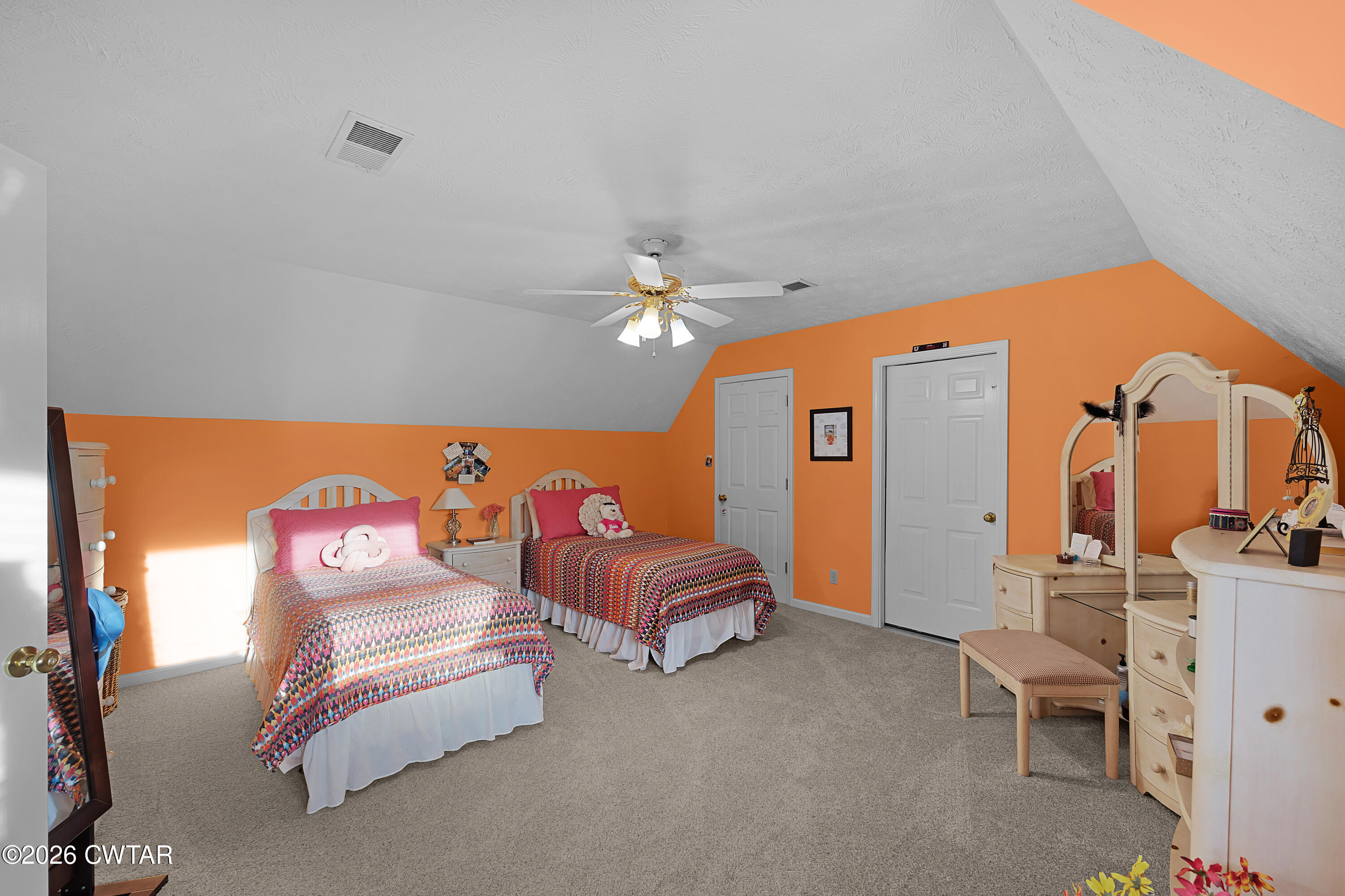 129 Pepper Tree Road Jackson, TN 38305 - Photo 24 of 35 a bedroom with furniture and a chandelier