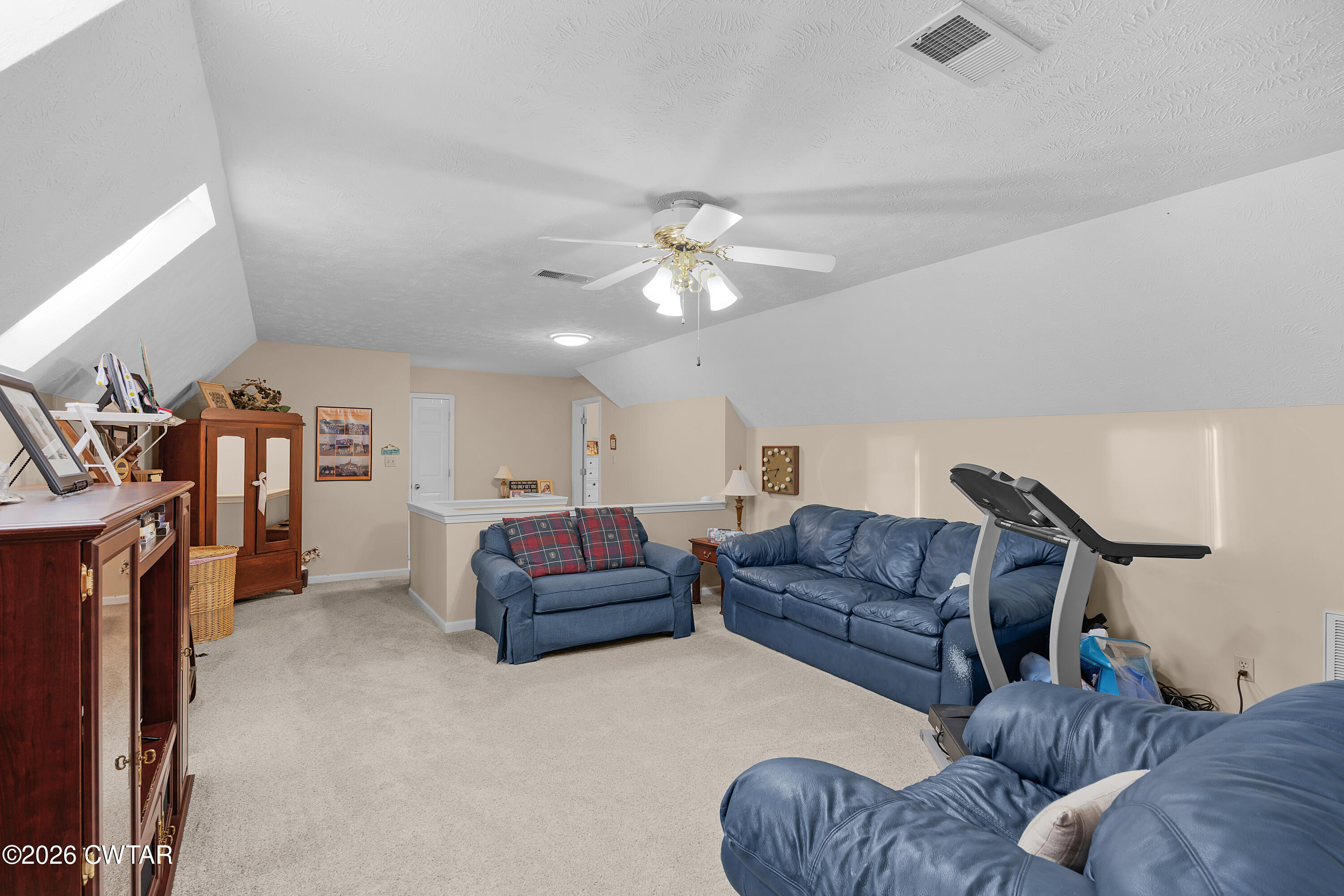 129 Pepper Tree Road Jackson, TN 38305 - Photo 26 of 35 a living room with furniture and a fireplace