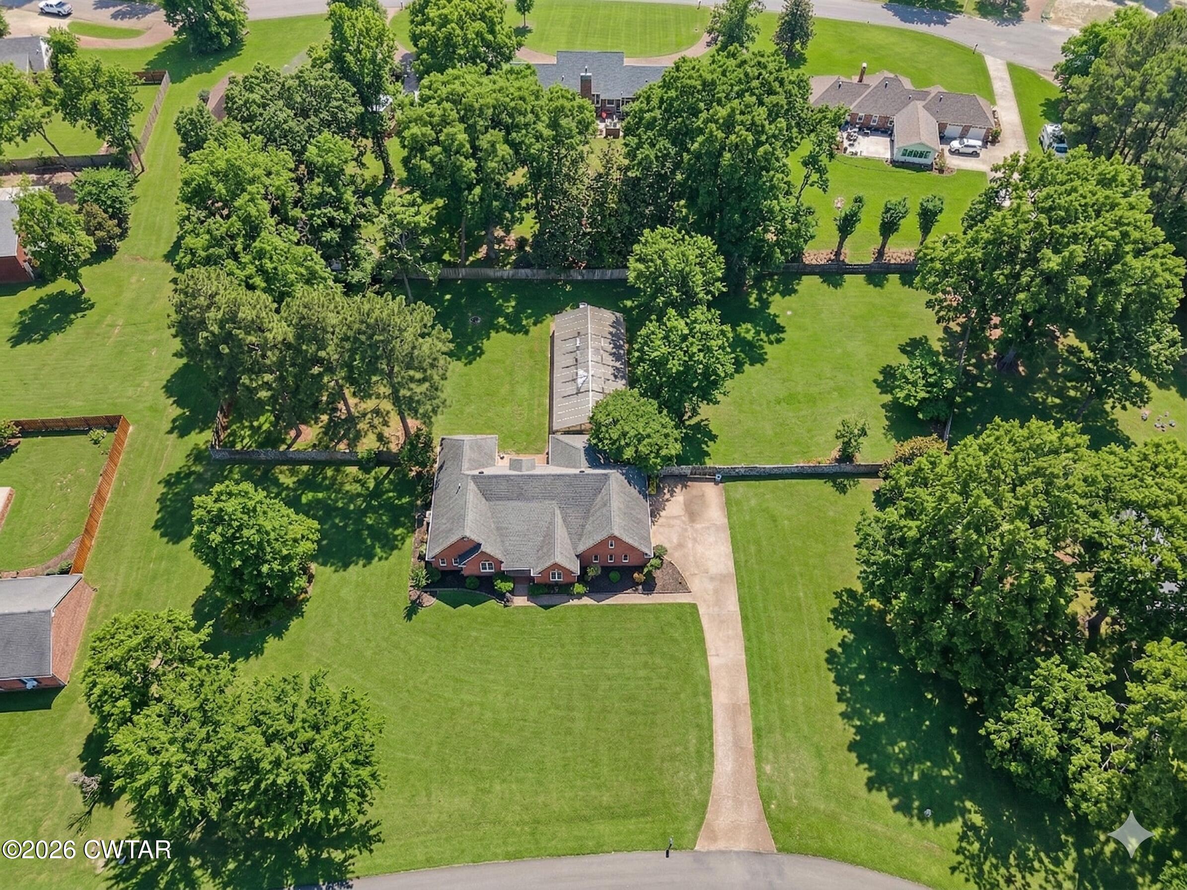 129 Pepper Tree Road Jackson, TN 38305 - Photo 35 of 35 an aerial view of residential house with outdoor space and trees all around