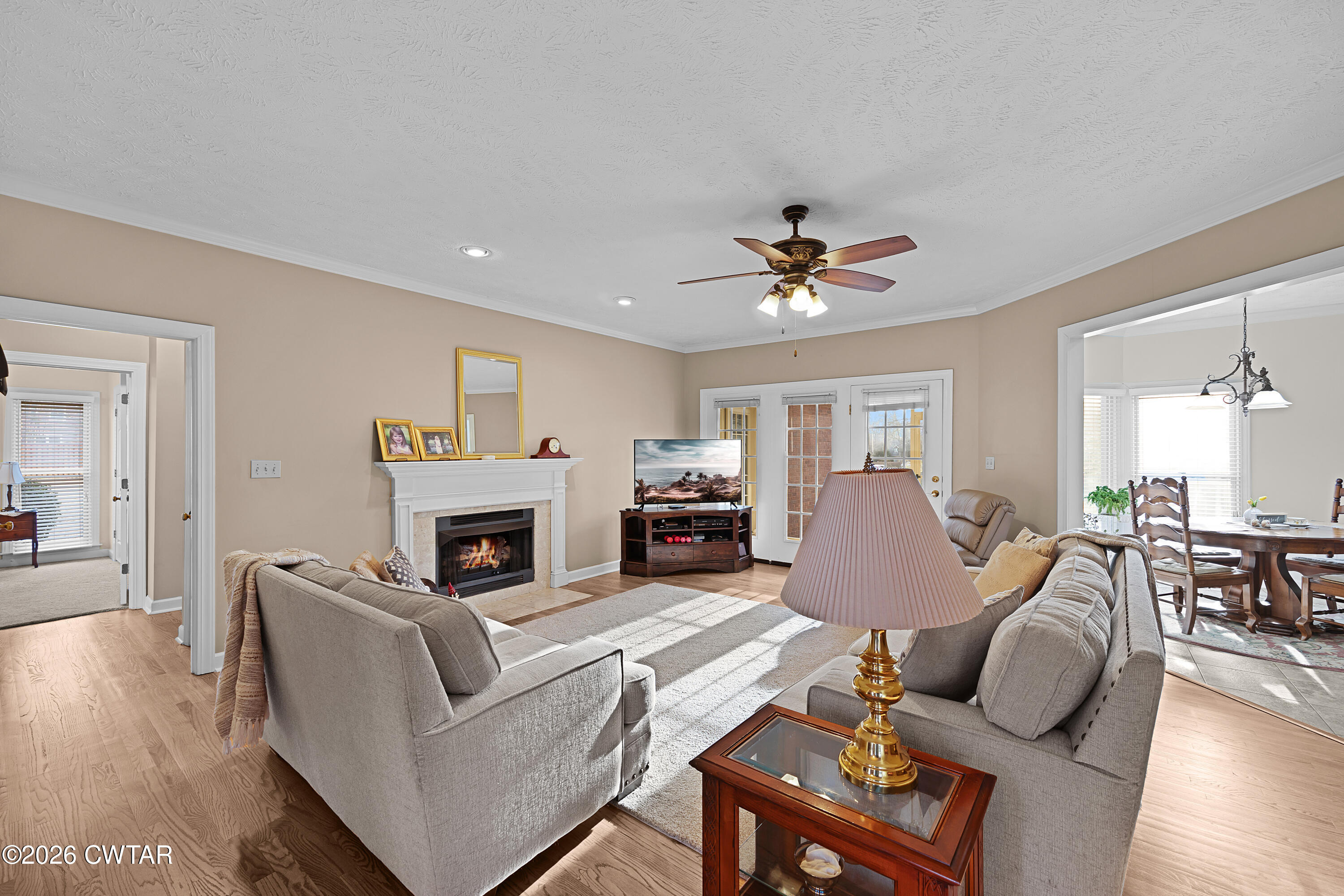 129 Pepper Tree Road Jackson, TN 38305 - Photo 8 of 35 a living room with furniture a fireplace and a window