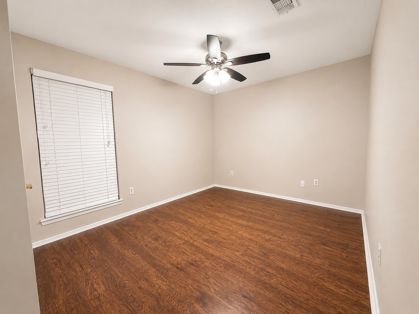 5810 Sunnygate Drive Spring, TX 77373 - Photo 8 of 16 wooden floor in an empty room with a window