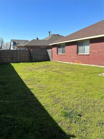 a view of a big yard with an outdoor space