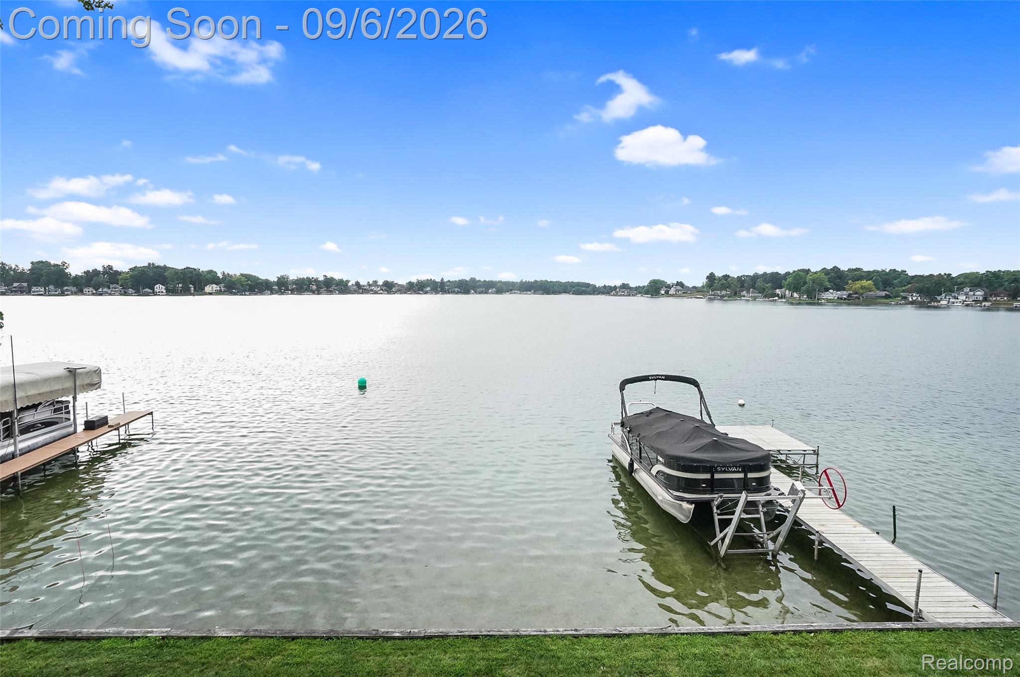 13203 Log Cabin Point Fenton, MI 48430 - Photo 45 of 55 Expansive waterfront with a private dock featuring a boat lift