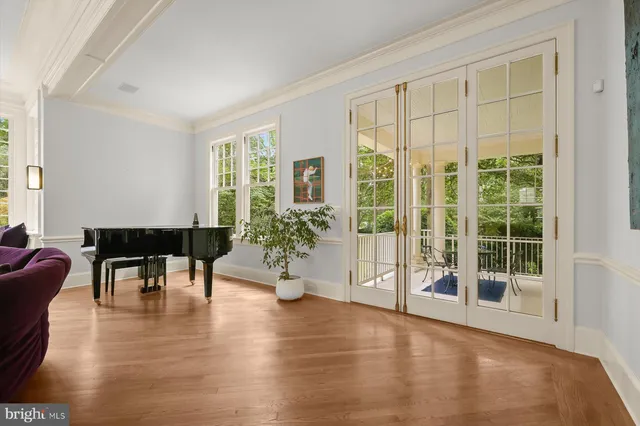 a view of a livingroom with furniture window and wooden floor