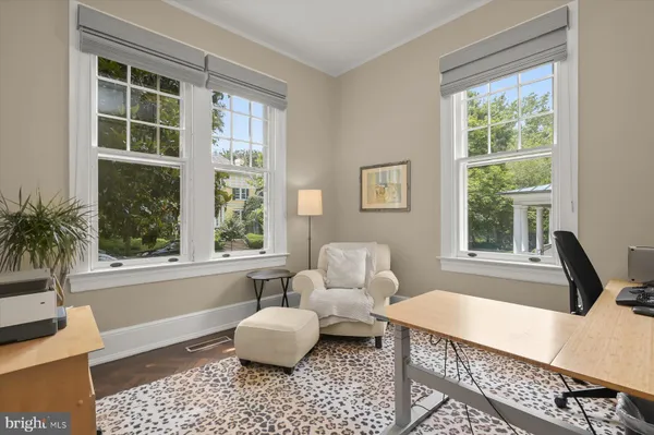 a bathroom with a granite countertop toilet sink and mirror