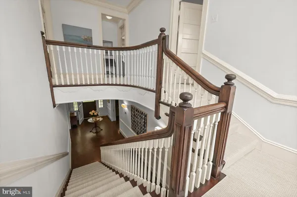 a bedroom with furniture and a chandelier