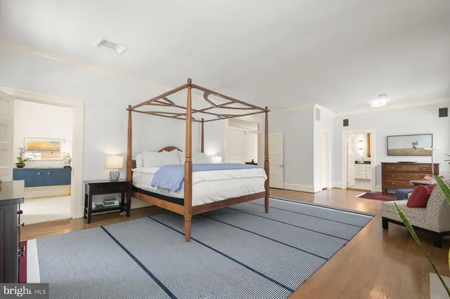 a bedroom with furniture and a fireplace