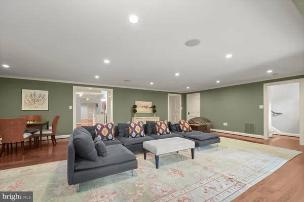 a room with pool table a table and chairs