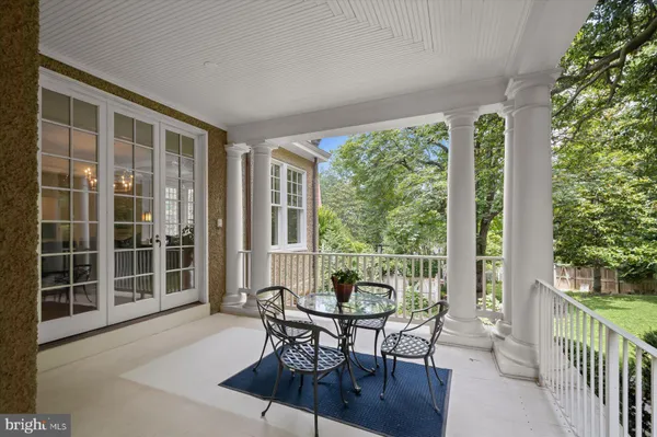 a view of a grassy field with trees