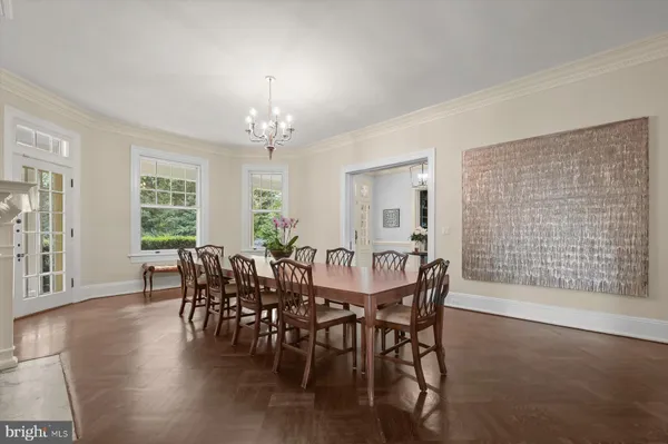 a view of a dining room with furniture and window
