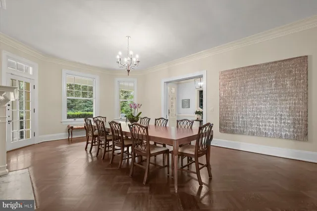 a view of a dining room with furniture and window