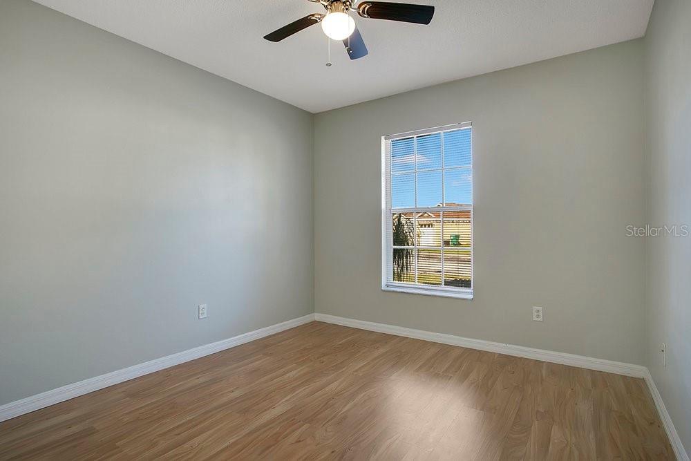 114 Sundance Court Winter Springs, FL 32708 - Photo 12 of 34 a view of an empty room with wooden floor and a window