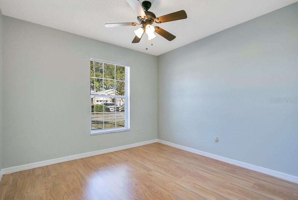 114 Sundance Court Winter Springs, FL 32708 - Photo 14 of 34 a view of an empty room with window and wooden floor