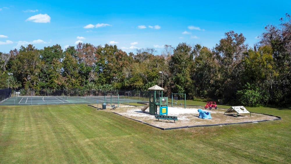 114 Sundance Court Winter Springs, FL 32708 - Photo 34 of 34 a view of a swimming pool with an outdoor seating