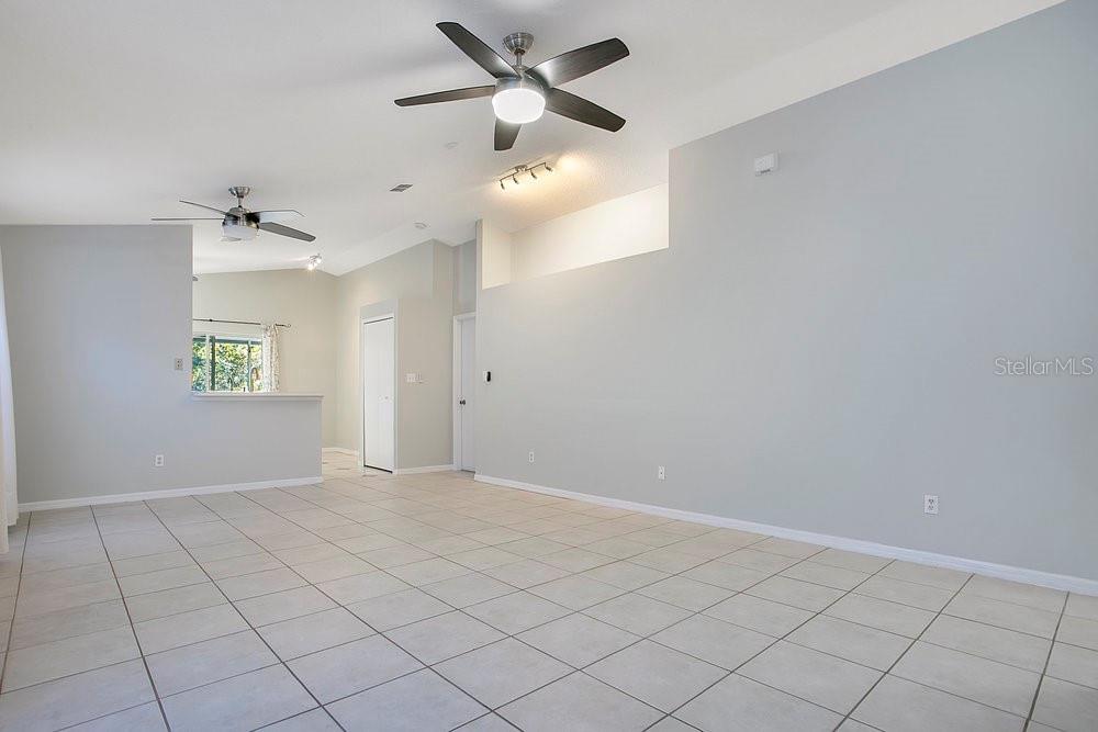 114 Sundance Court Winter Springs, FL 32708 - Photo 4 of 34 wooden floor in an empty room with a window