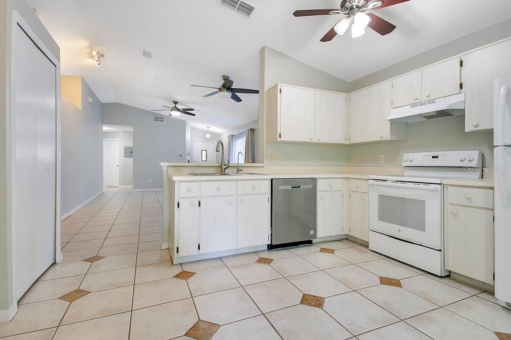 114 Sundance Court Winter Springs, FL 32708 - Photo 10 of 34 a kitchen with a stove sink and cabinets