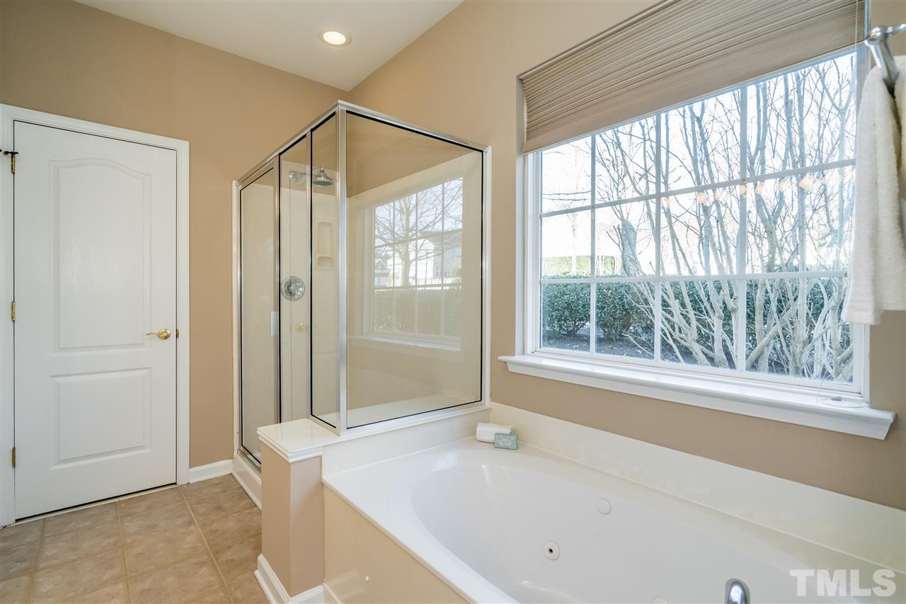 5405 Brandy Bay Road Raleigh, NC 27613 - Photo 14 of 23 Large bathroom has a soaking tub, separate shower & walk in closet (not pictured).
