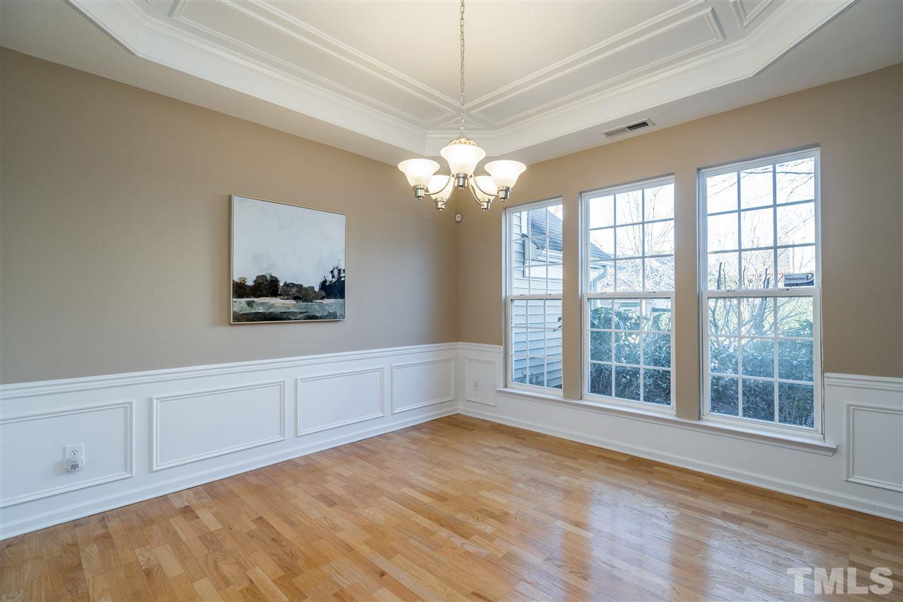5405 Brandy Bay Road Raleigh, NC 27613 - Photo 3 of 23 Separate Dining Room with Wainscoting & Tray Ceiling