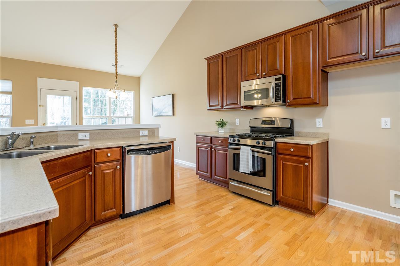 5405 Brandy Bay Road Raleigh, NC 27613 - Photo 7 of 23 Stainless appliances, gas range and lots of counter space in this lovely kitchen.