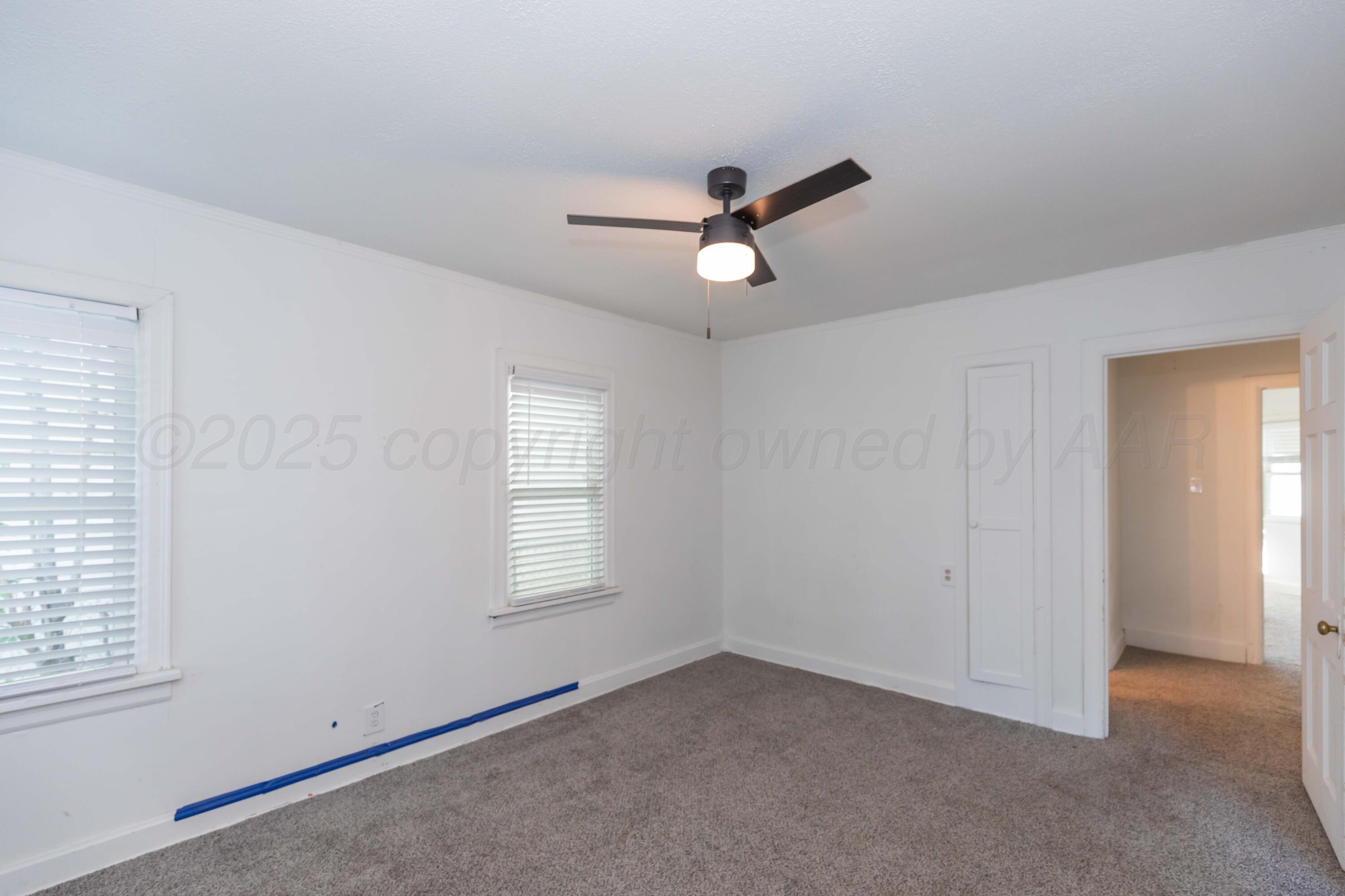 1214 Southwest 12th Avenue Amarillo, TX 79102 - Photo 17 of 25 wooden floor in an empty room with a window