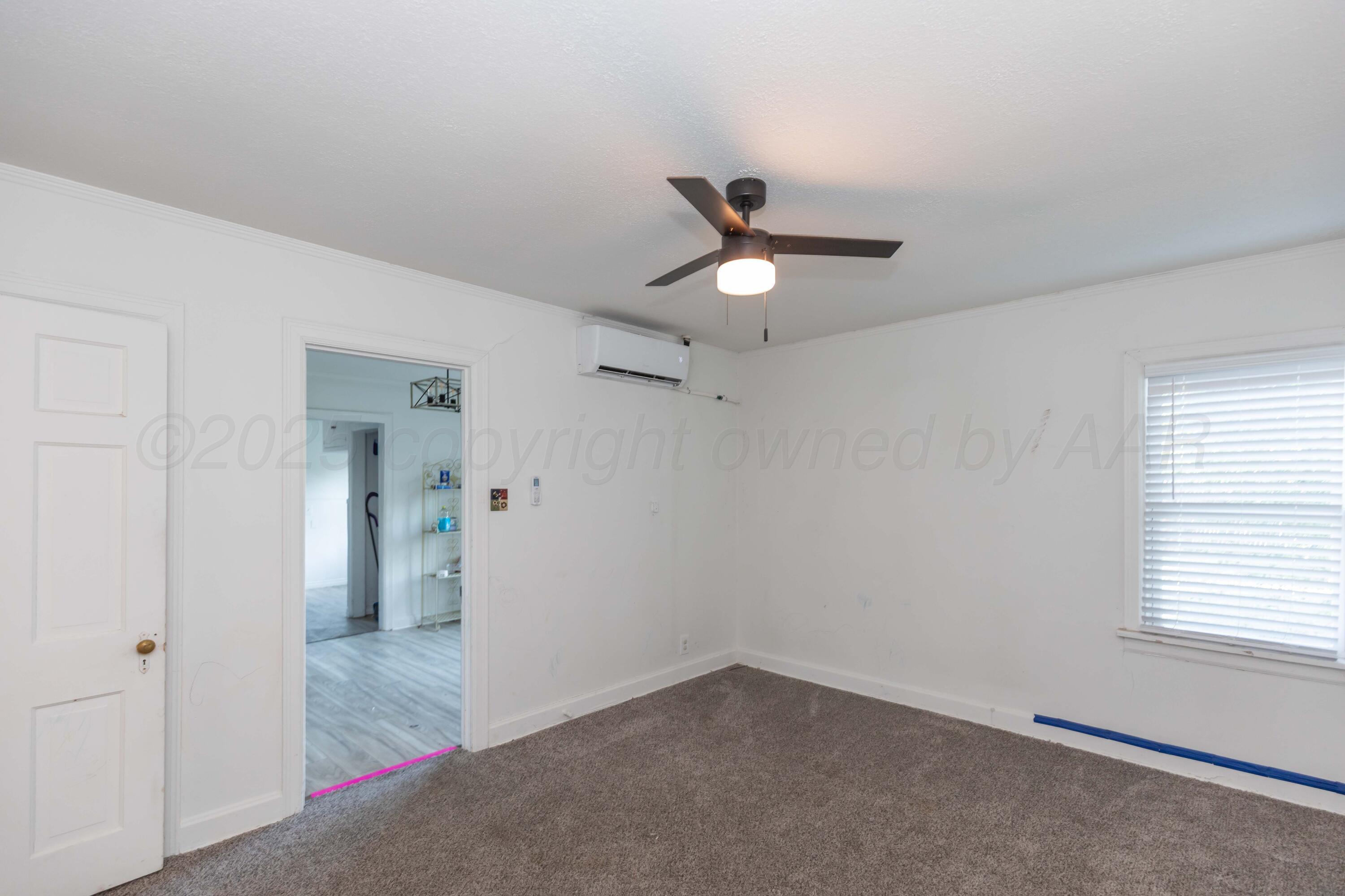 1214 Southwest 12th Avenue Amarillo, TX 79102 - Photo 18 of 25 an empty room with window and closet