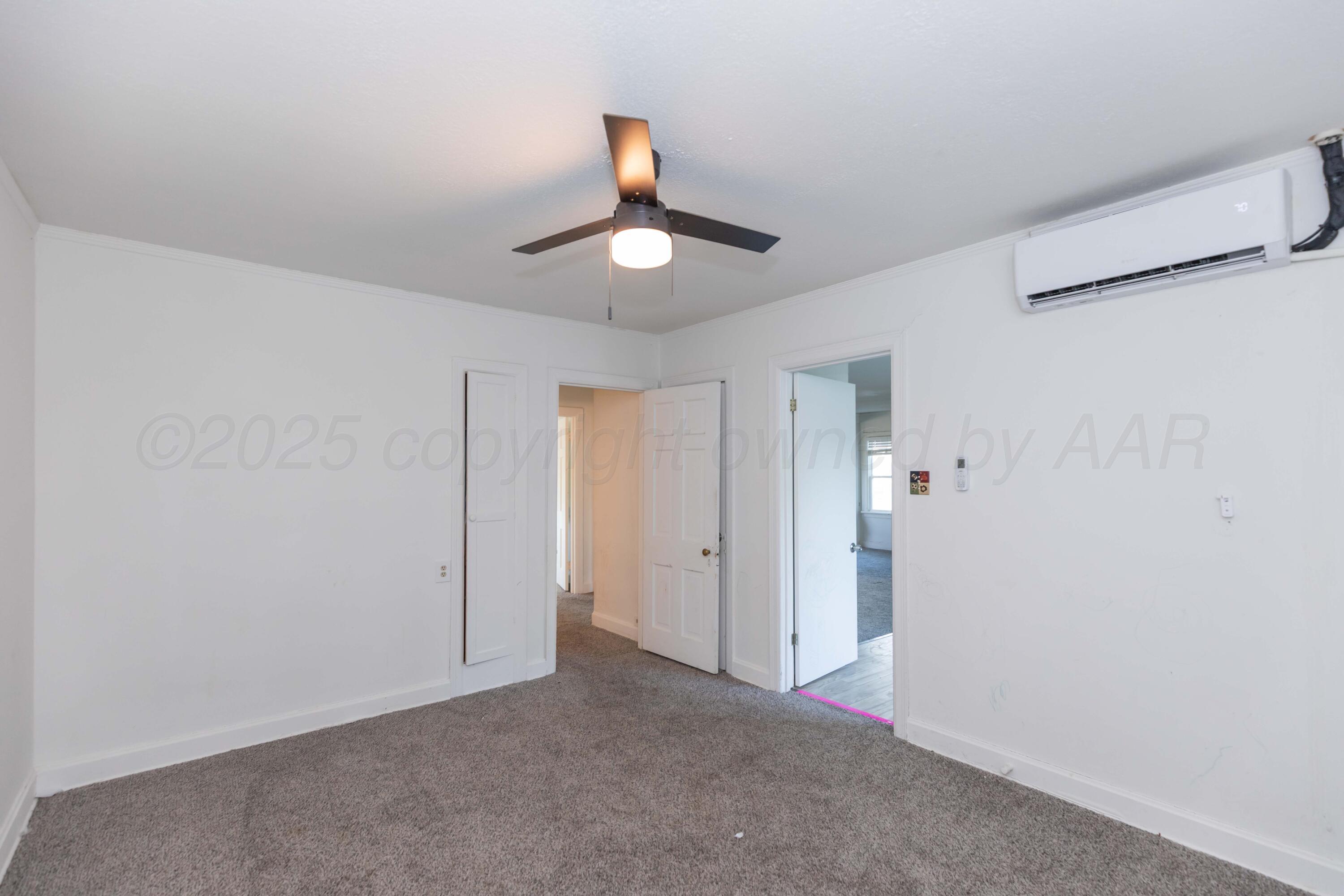 1214 Southwest 12th Avenue Amarillo, TX 79102 - Photo 19 of 25 a view of an empty room and chandelier fan