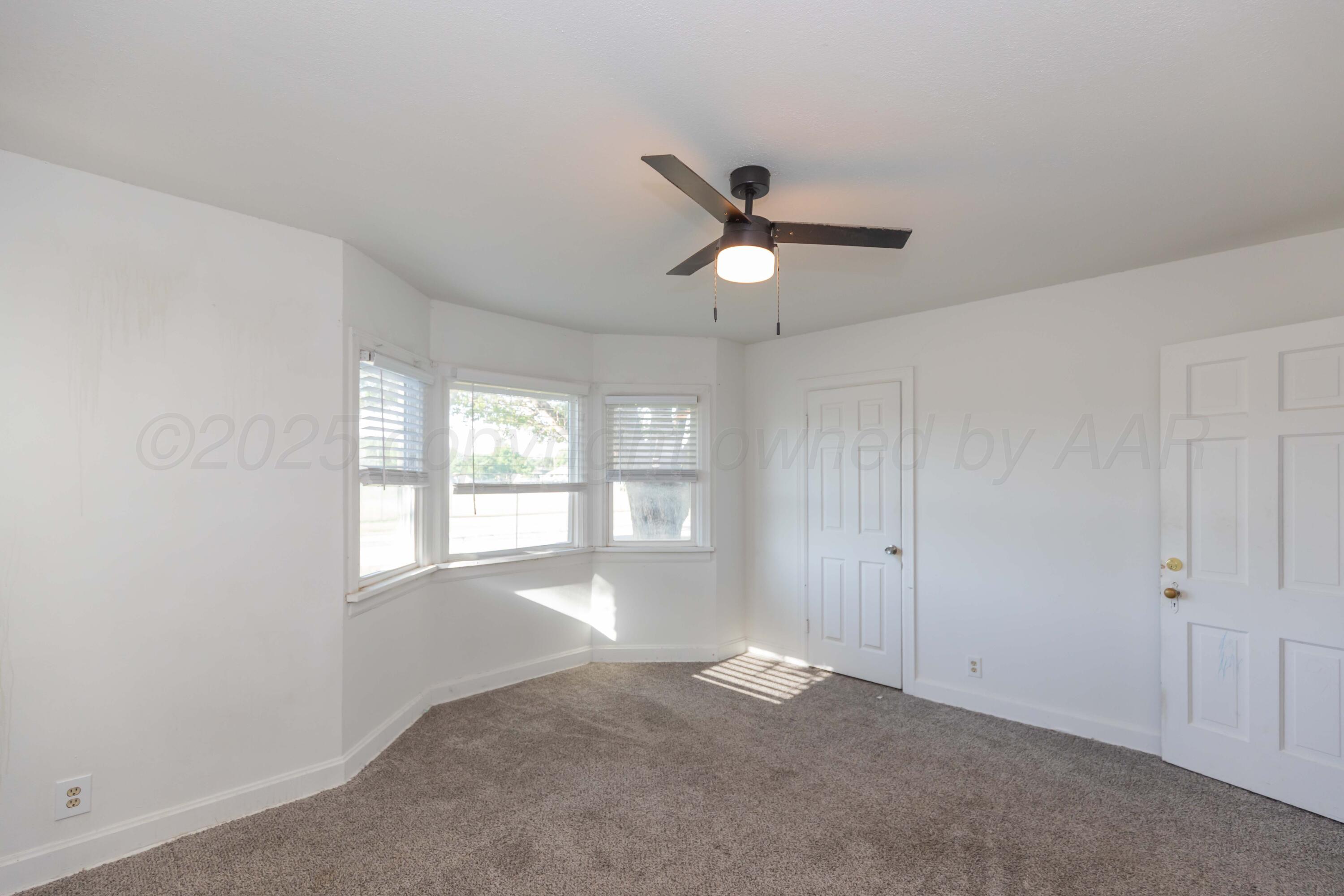 1214 Southwest 12th Avenue Amarillo, TX 79102 - Photo 20 of 25 a view of an empty room with a window