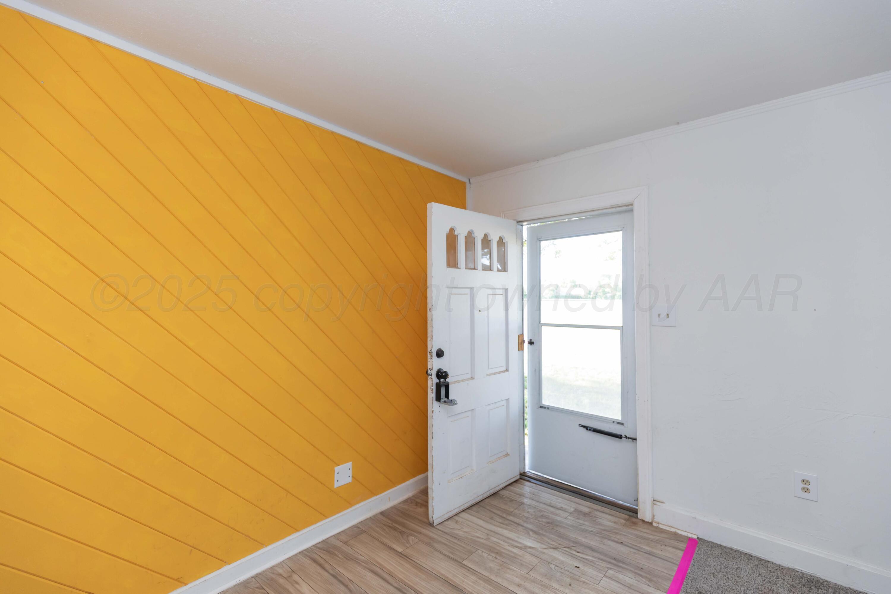 1214 Southwest 12th Avenue Amarillo, TX 79102 - Photo 3 of 25 a view of an empty room and window