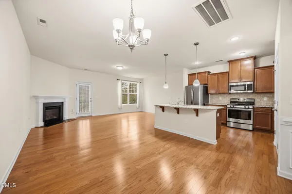 a view of kitchen with sink microwave and stove