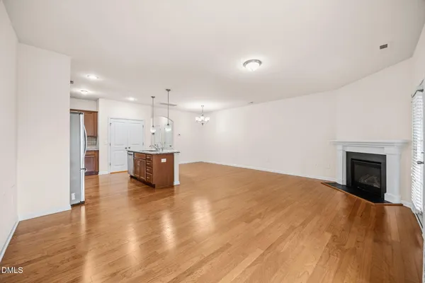 a view of a kitchen with a sink and a fireplace