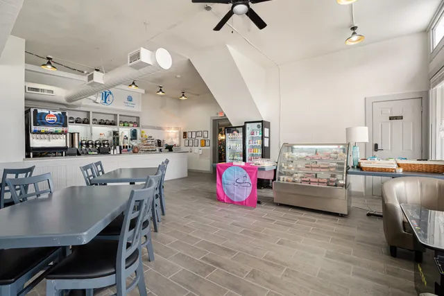 a room with furniture pool table and flat screen tv
