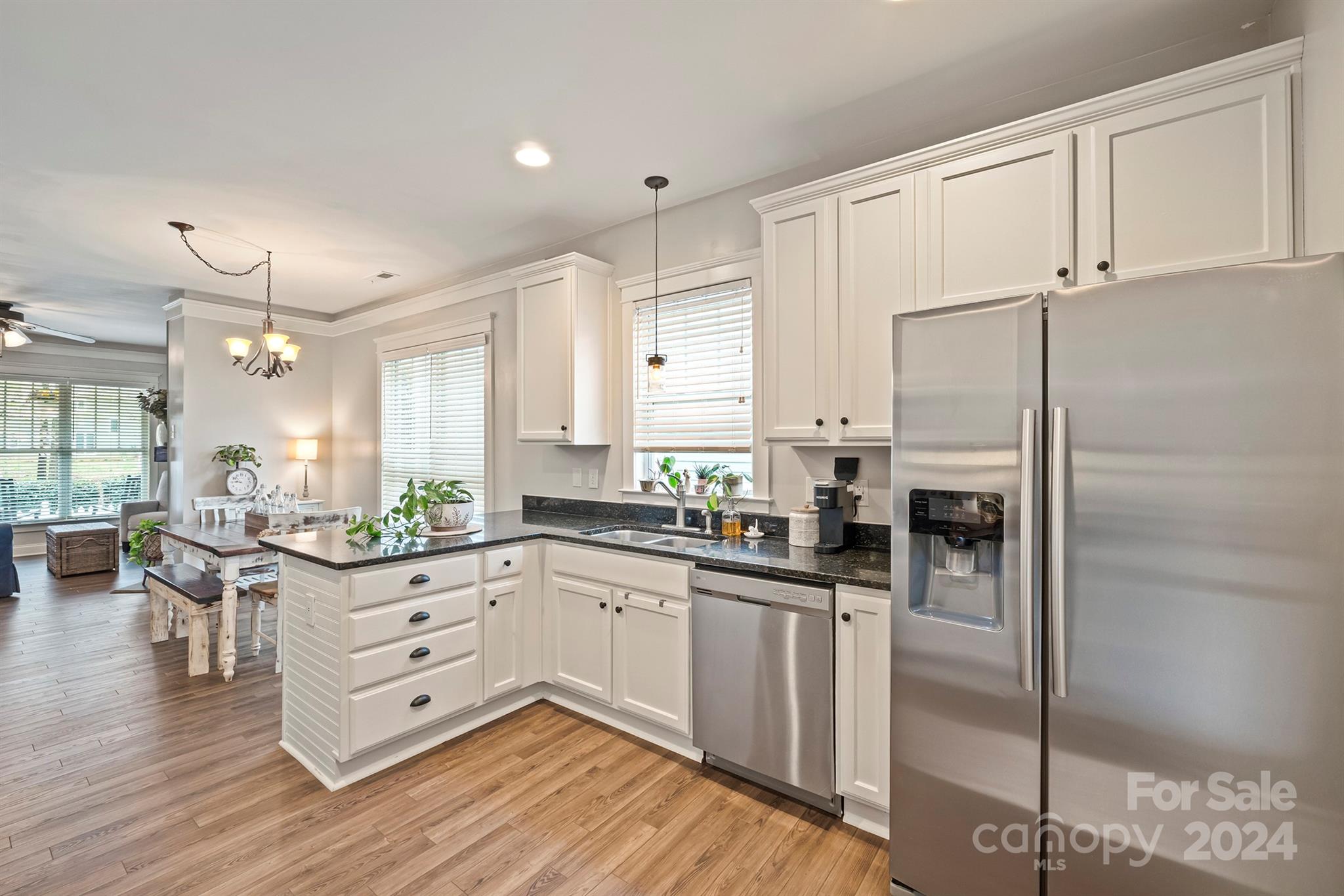13516 Stumptown Road Huntersville, NC 28078 - Photo 13 of 37 a kitchen with white cabinets and stainless steel appliances