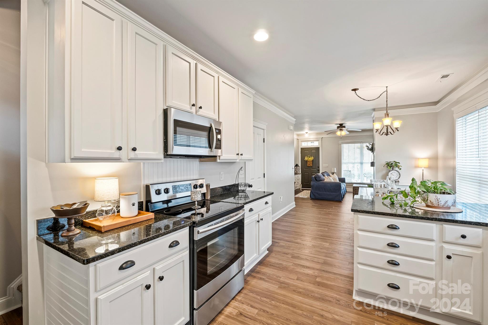 13516 Stumptown Road Huntersville, NC 28078 - Photo 14 of 37 a kitchen with stainless steel appliances a stove a sink and a refrigerator